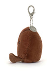 A small, brown, plush kiwi bird keychain with a metal clip and tag on top. Its cute round body and fuzzy texture make it an adorable accessory—great to pair with your Jelly Cat Inc. Amuseables Coffee Bean Bag Charm.