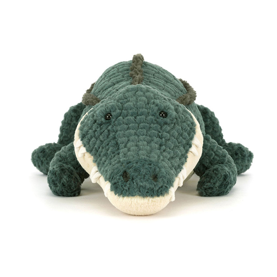 The Allexi Alligator by Jelly Cat Inc. is a green plush toy with textured, corduroy-like fabric and a soft, cream-colored snout—perfect for veggie Southern cuisine fans or as playful Louisiana diner decor. Lies flat with head forward.