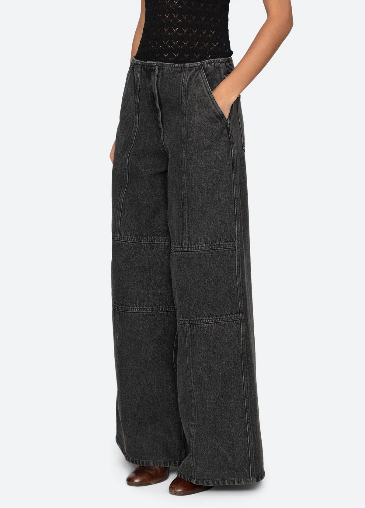 Zayna Denim Wide Leg Jeans by Sea New York with visible seams, paired with a black top and brown shoes.