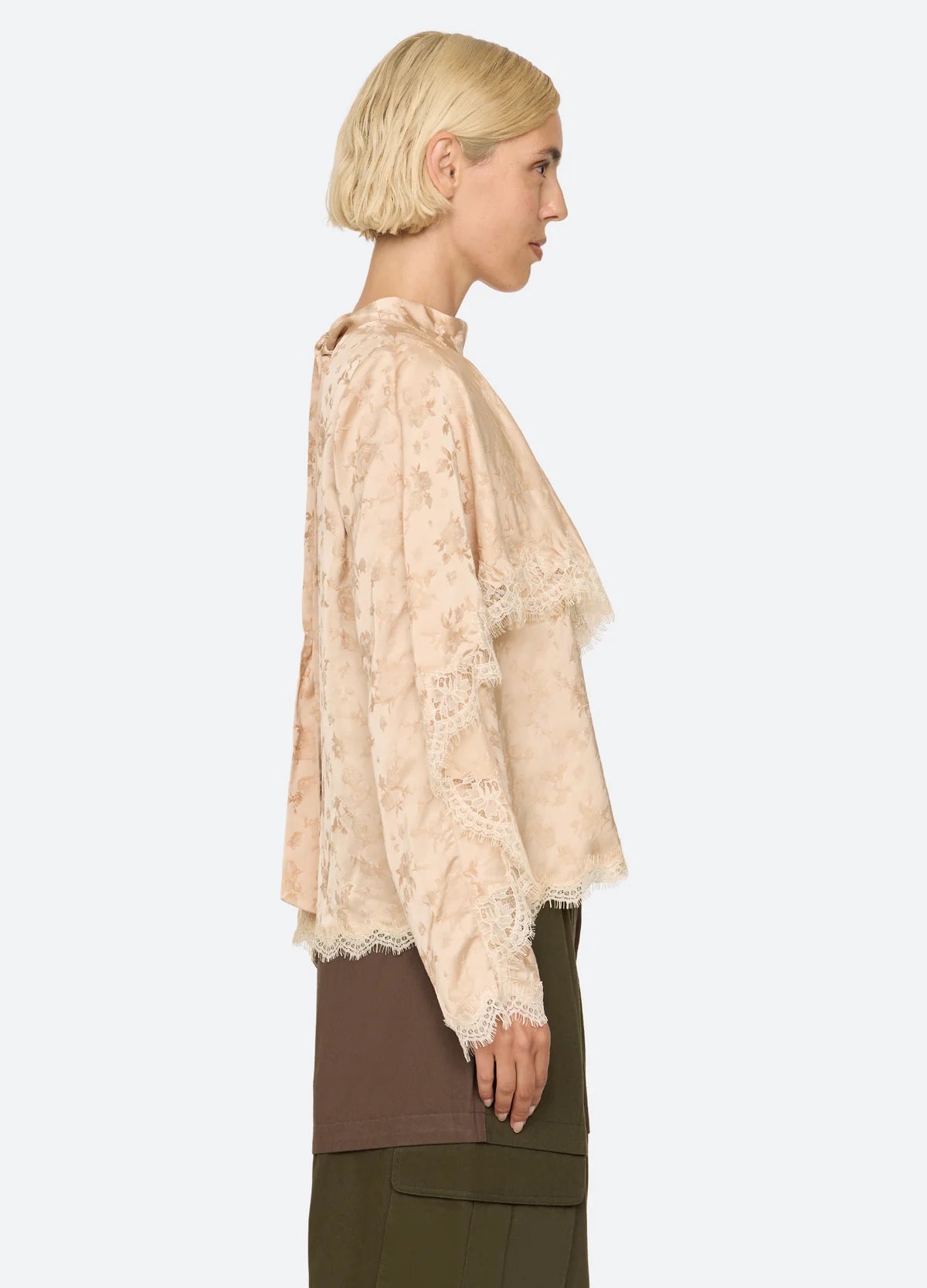 Sea New York Shay Lace LS Top and layered skirt in profile, featuring delicate lace and modern styling.