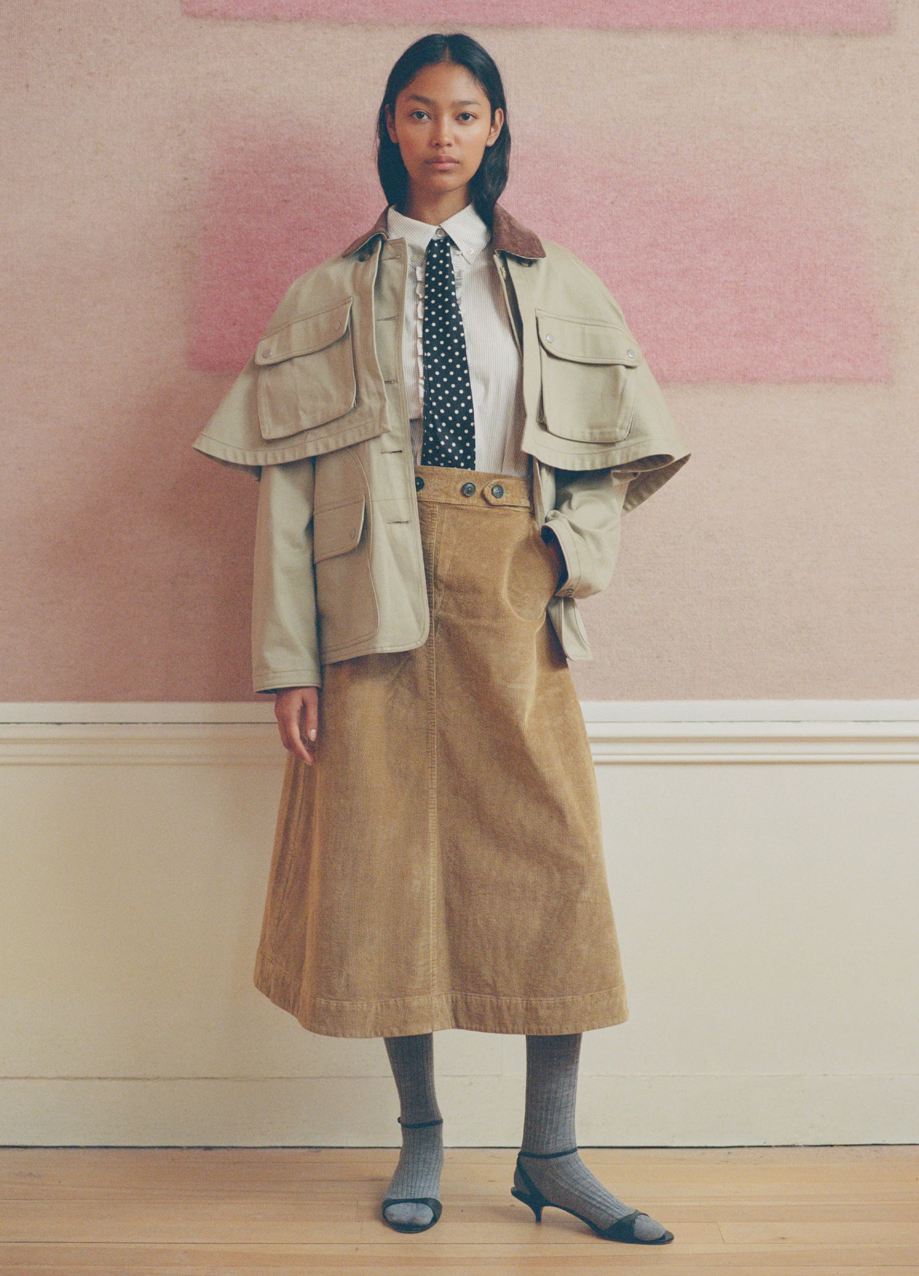 Sea New York corduroy midi skirt in beige styled with a jacket and polka dot tie for a modern, chic look.