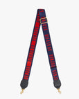 The Clare Vivier Crossbody Strap S25 features navy blue cotton webbing with bold red "BONJOUR AU REVOIR" text, finished with gold clasps and black leather accents.