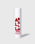 The Faire All Balm Stick is a white cylindrical tube labeled "ALL BALM" in bold red, offering cherry-scented, non-greasy hydration with natural ingredients for lips, hands, and body. It stands upright on a plain light gray background.