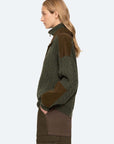 Green Sea New York Allen Cable Half Zip Sweater on model, cable knit detail, profile view against light background.