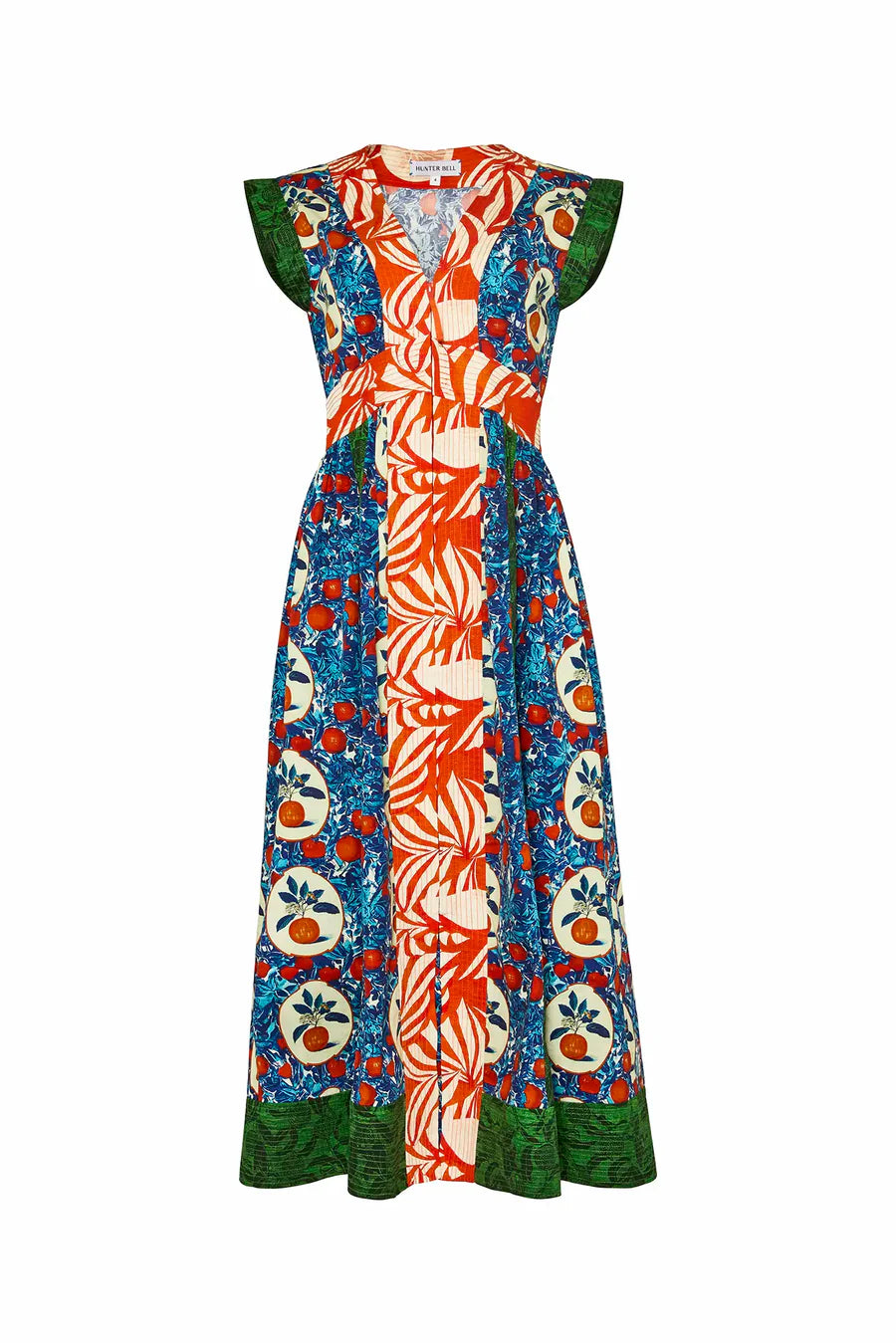 The April Dress from Hunter Bell NYC features a V-neckline, sleeveless design, and vibrant vertical panels. It boasts bold orange grove mixed print patterns in orange, blue, green, with red fruit and leaf motifs for an eye-catching look.