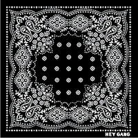 The HG Bandana by Hey Gang features intricate white paisley, floral, and dotted patterns in a symmetrical design with "HEY GANG" in the corner—an ideal accessory for everyday style.