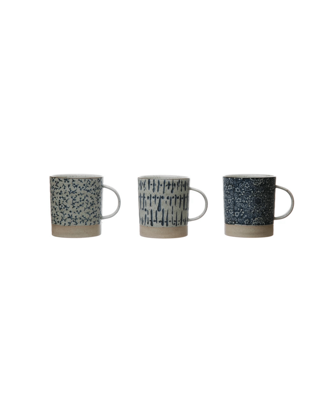 Displayed against a white background, Creative Co-op's "Hand-Stamped Stoneware Mug, 3 Styles" set showcases three mugs, each with unique blue patterns: small speckles, vertical dashes, and intricate floral designs—an ideal addition to any eclectic tableware collection.