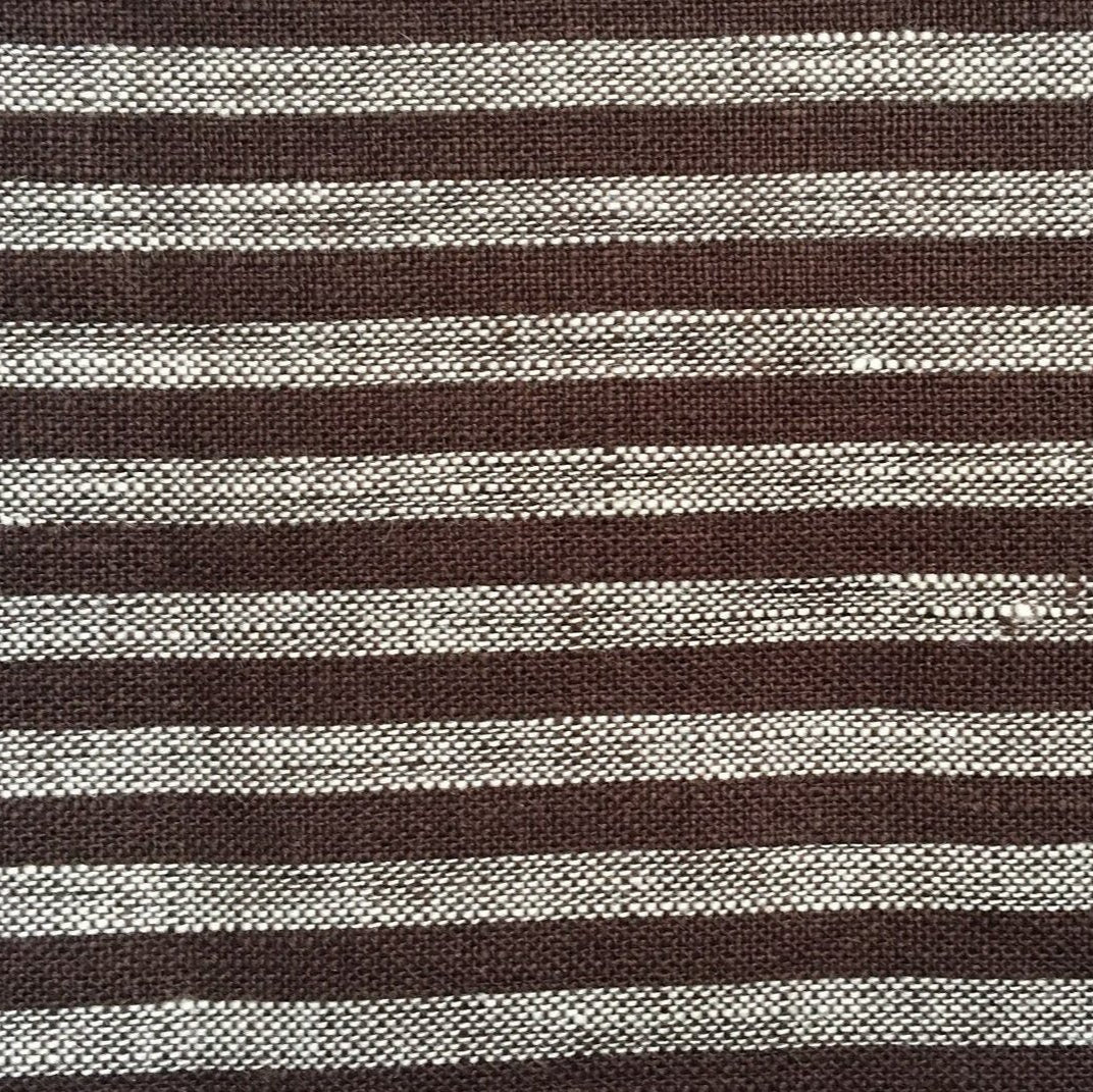 Close-up of a woven fabric from Modernplum's Baltic Dutch Euro, showing alternating horizontal dark brown and off-white stripes inspired by Baltic Stripe bedding, with the material’s texture and weave clearly visible.