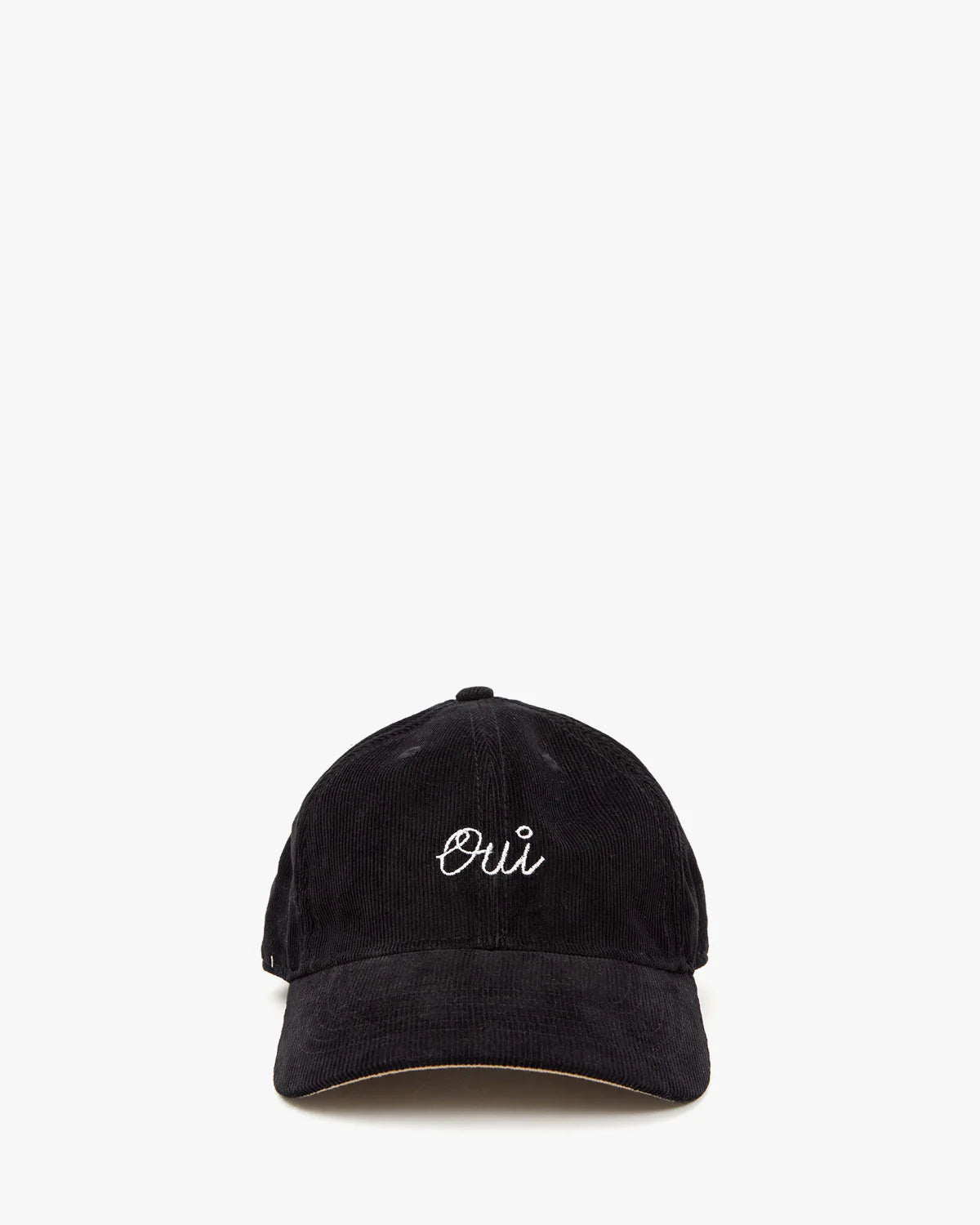 The Clare Vivier Baseball Hat, a black corduroy design, features "Oui" embroidered in white on the front. Perfect for that celebrity-in-disguise look against a plain white background.