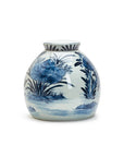 The BLF164 Blue White Ginger Jar by Two's Company is a round, white ceramic jar with a narrow neck, featuring blue floral and leaf patterns in traditional water and plant motifs.