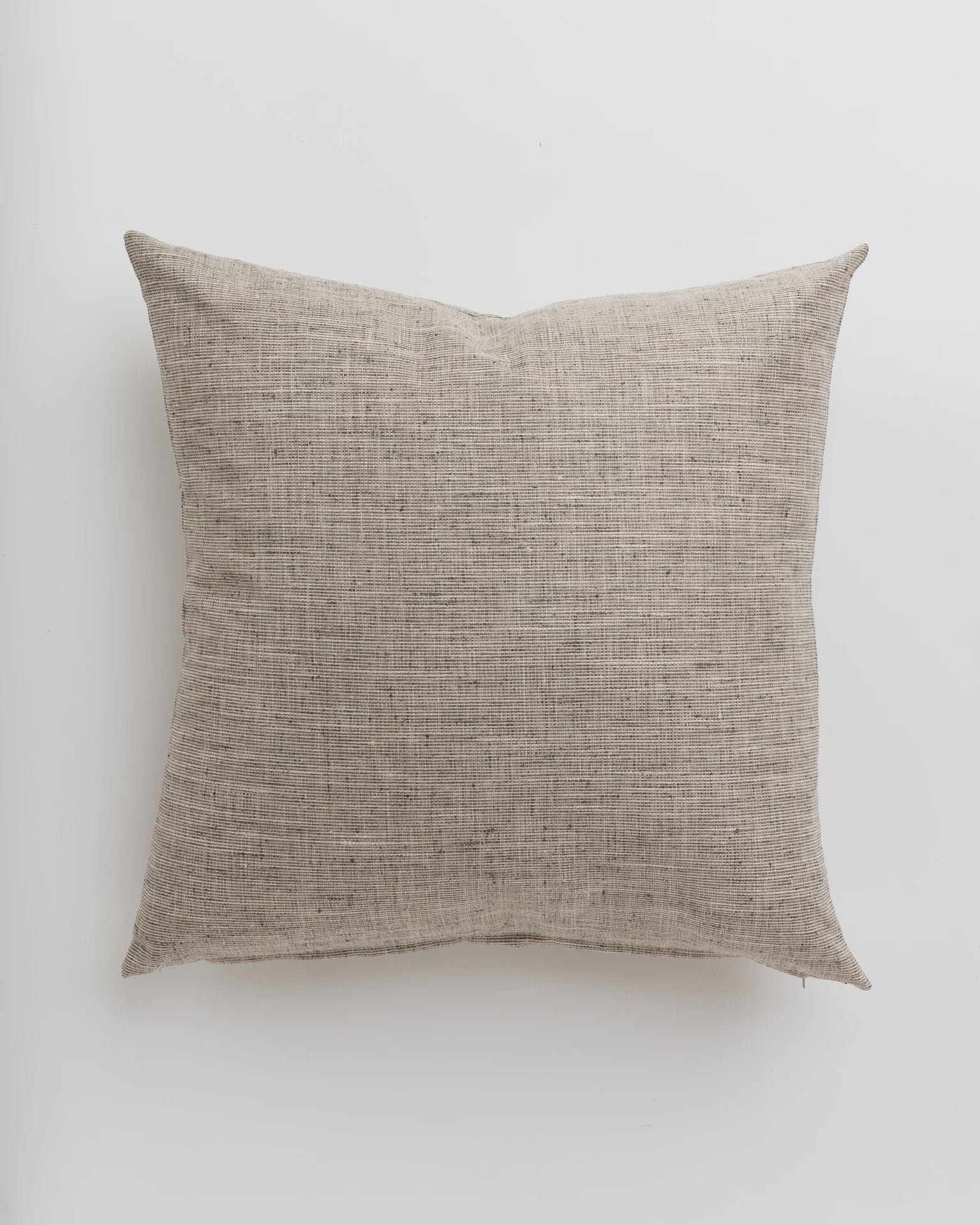 A plain, square-shaped Grasscloth Steel Pillow 26x26 displayed against a white background in a Scottsdale Arizona bungalow by Gabby.