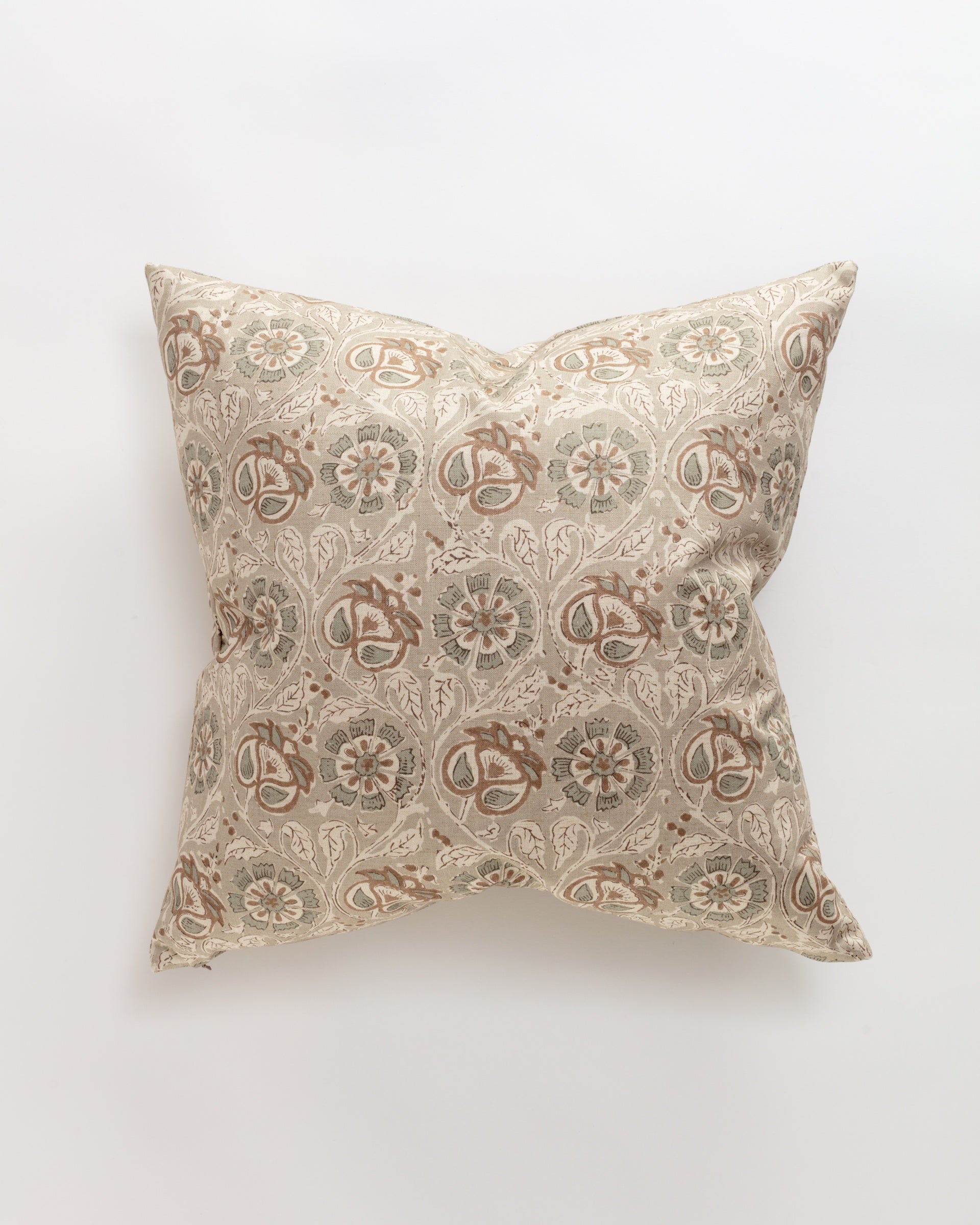 The Norwalk Carrie Pillow is a square, ultra-luxurious beige pillow featuring an intricate floral and circular design in muted green and brown tones. Perfect for support and relaxation, it is elegantly showcased against a plain white background.