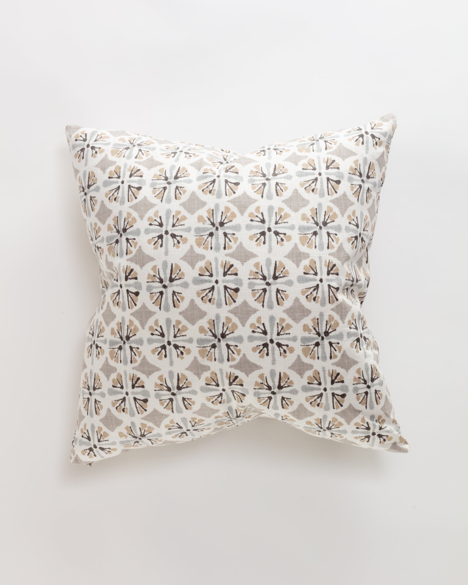 The Amelie Pillow by Norwalk features a geometric pattern with beige and gray floral motifs on white, offering luxurious style and support. The custom-made design is uniformly repeated and displayed beautifully against a plain white backdrop.