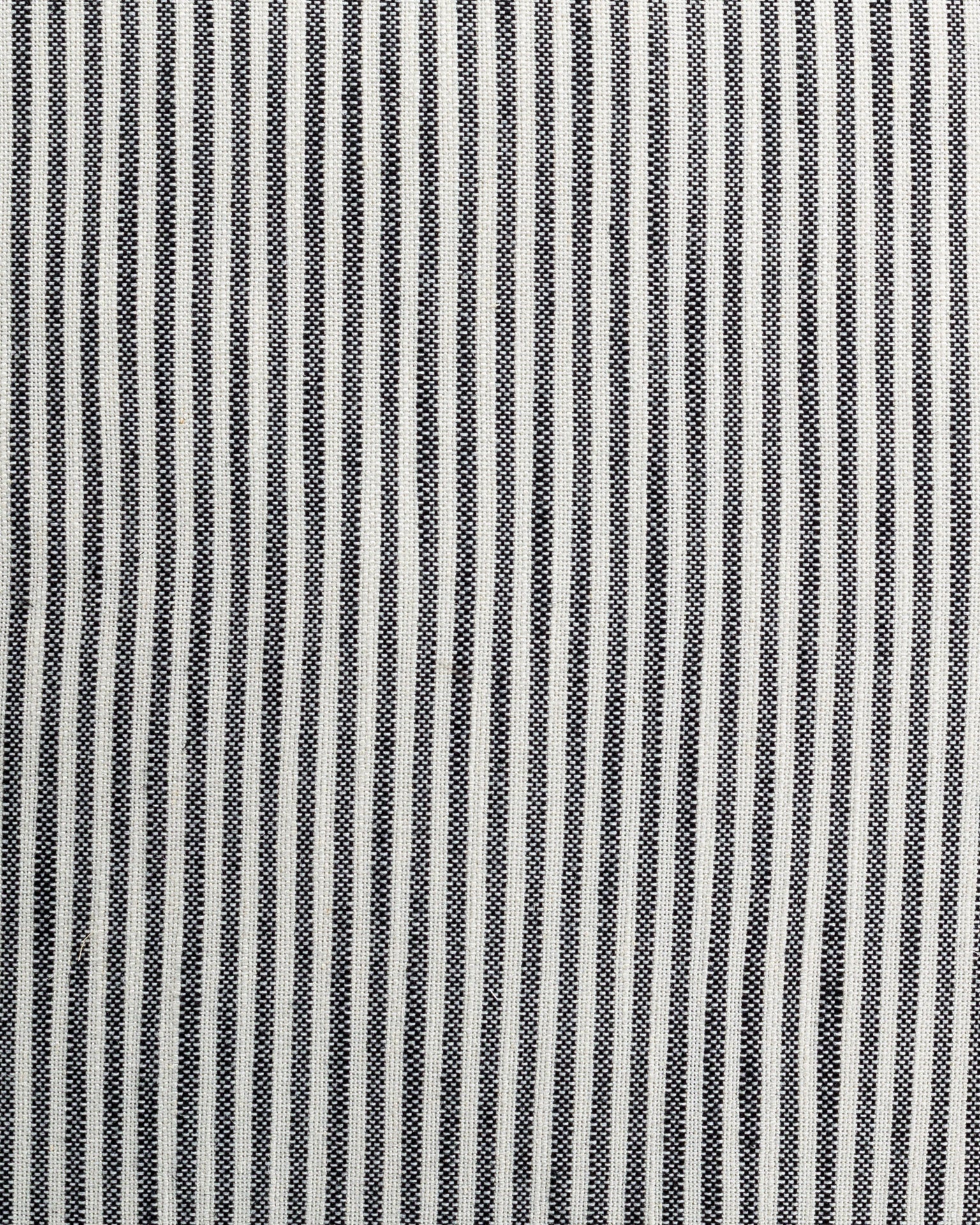 Black and white striped pattern with alternating narrow and broad stripes, creating a textured visual effect on a Gabby Skinny Stripe Classic Pillow 26x26 fabric surface.