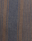 Close-up of a Casual Stripe Bark 24x24" fabric with alternating brown and navy blue stripes, detailed with fine white dots on the navy sections in a Scottsdale bungalow by Gabby.
