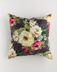 The Custom 1 Pillow 28x28 by Pindler is an ultra-luxurious square throw pillow that boasts a dark charcoal background adorned with a vibrant floral pattern. Featuring large flowers in shades of yellow, pink, and green complemented by delightful white and red accents, this custom-made pillow adds an exquisite touch to any space.