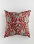 The Custom 1 Pillow 28x28 by Pindler is a luxurious decorative square pillow with a red background, showcasing an intricate pattern of birds, flowers, and leaf motifs in blue, beige, and green. This traditional design, reminiscent of Persian or oriental art, perfectly complements Euro pillows or your favorite pillow insert.