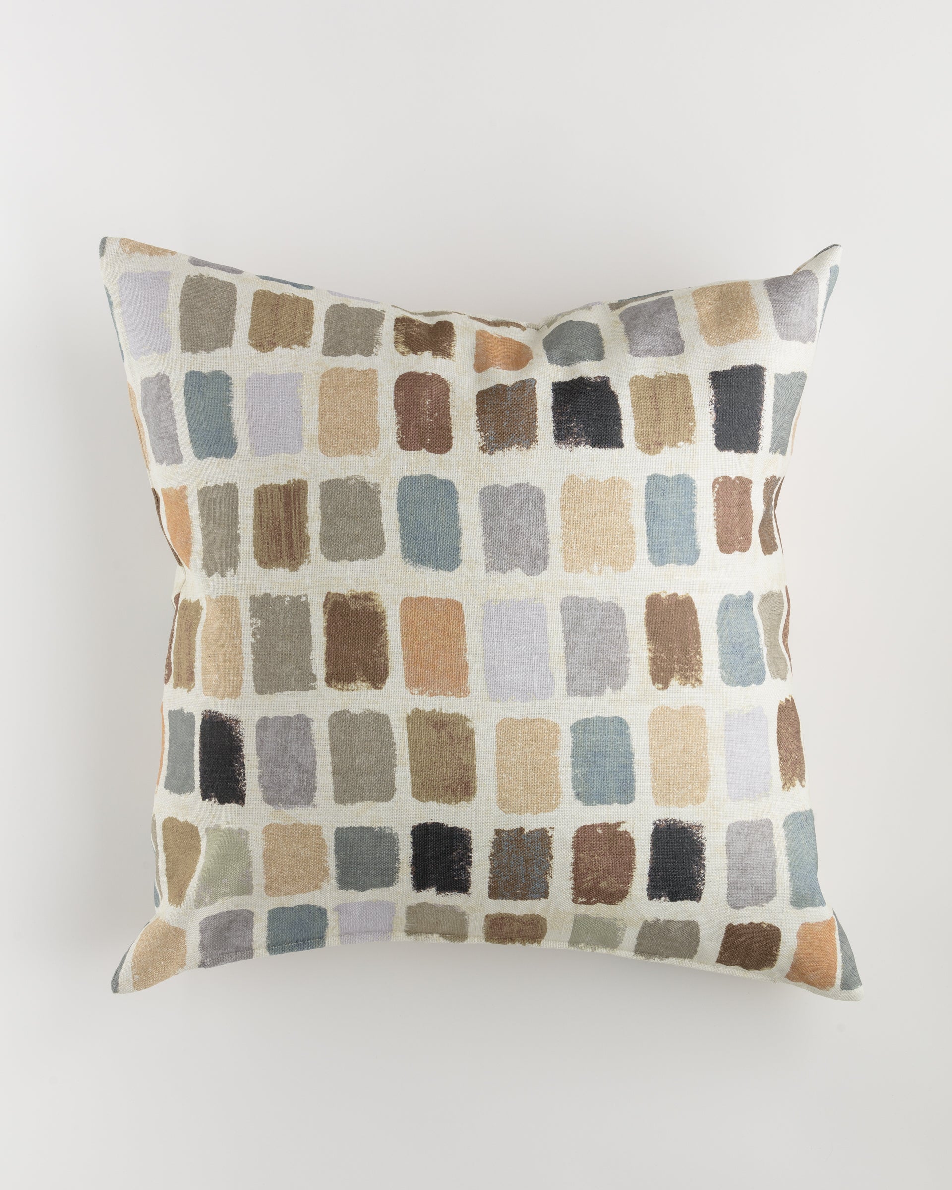 Presenting the Custom 2 Pillow 28x28 by Pindler, a luxurious square cushion featuring a modern and artistic pattern of rectangular swatches in various shades of beige, brown, gray, and blue on a light background. Each swatch resembles a small brush stroke. Perfect for euro pillows or adding with your pillow insert.