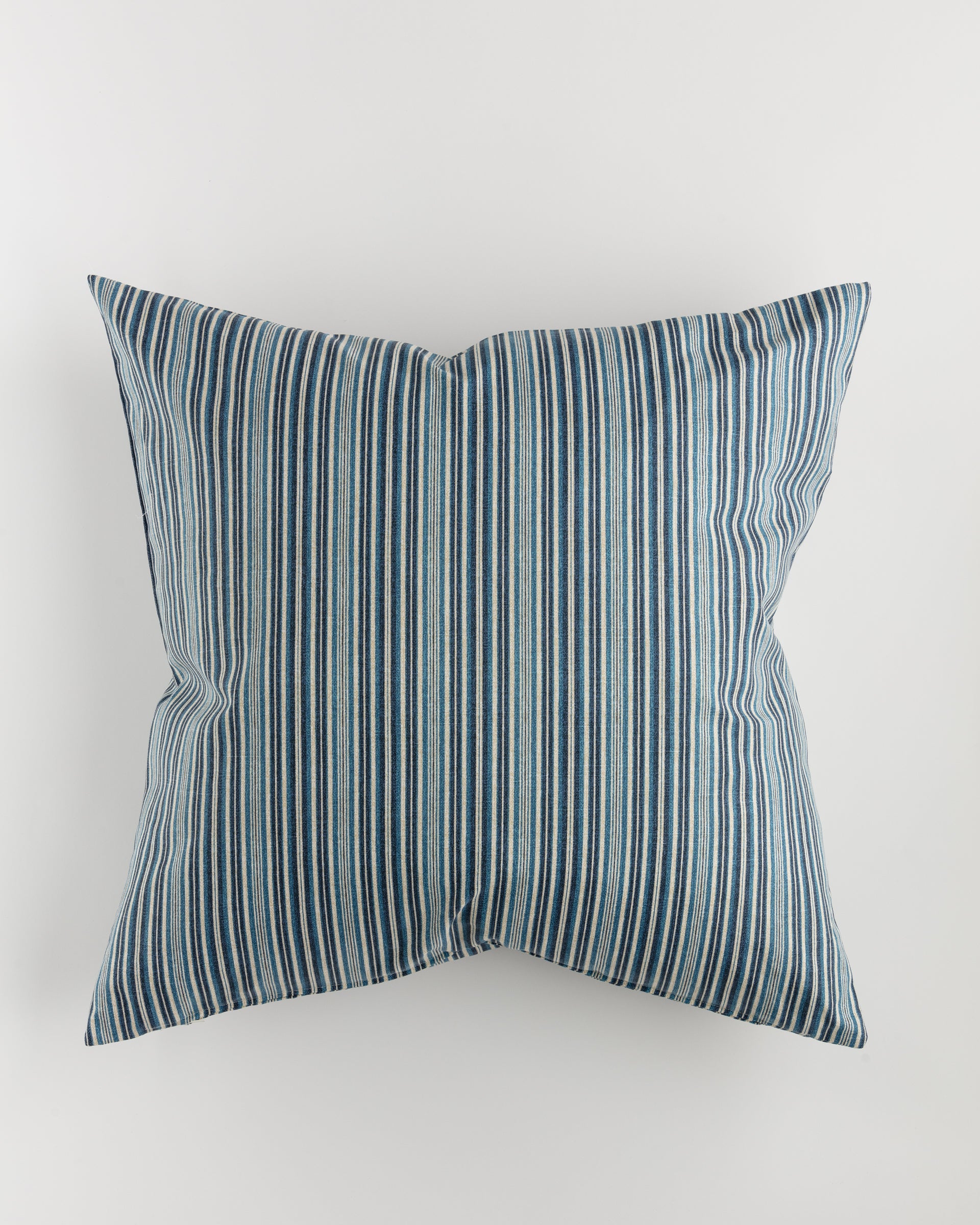 Introducing the Pindler Custom 1 Pillow 28x28—a luxurious euro cushion adorned with a cover that features vertical blue and white stripes. The alternating pattern of thicker and thinner lines creates a sophisticated textured appearance, all set against a pristine white background. Complete with an included pillow insert, this elegant piece is sure to elevate any space.