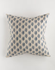 The Custom 1 Pillow 28x28 by Pindler features a square, beige background adorned with a pattern of small blue floral designs. Centered against a plain white backdrop, this luxurious pillow exemplifies intricate detailing and minimalist elegance.