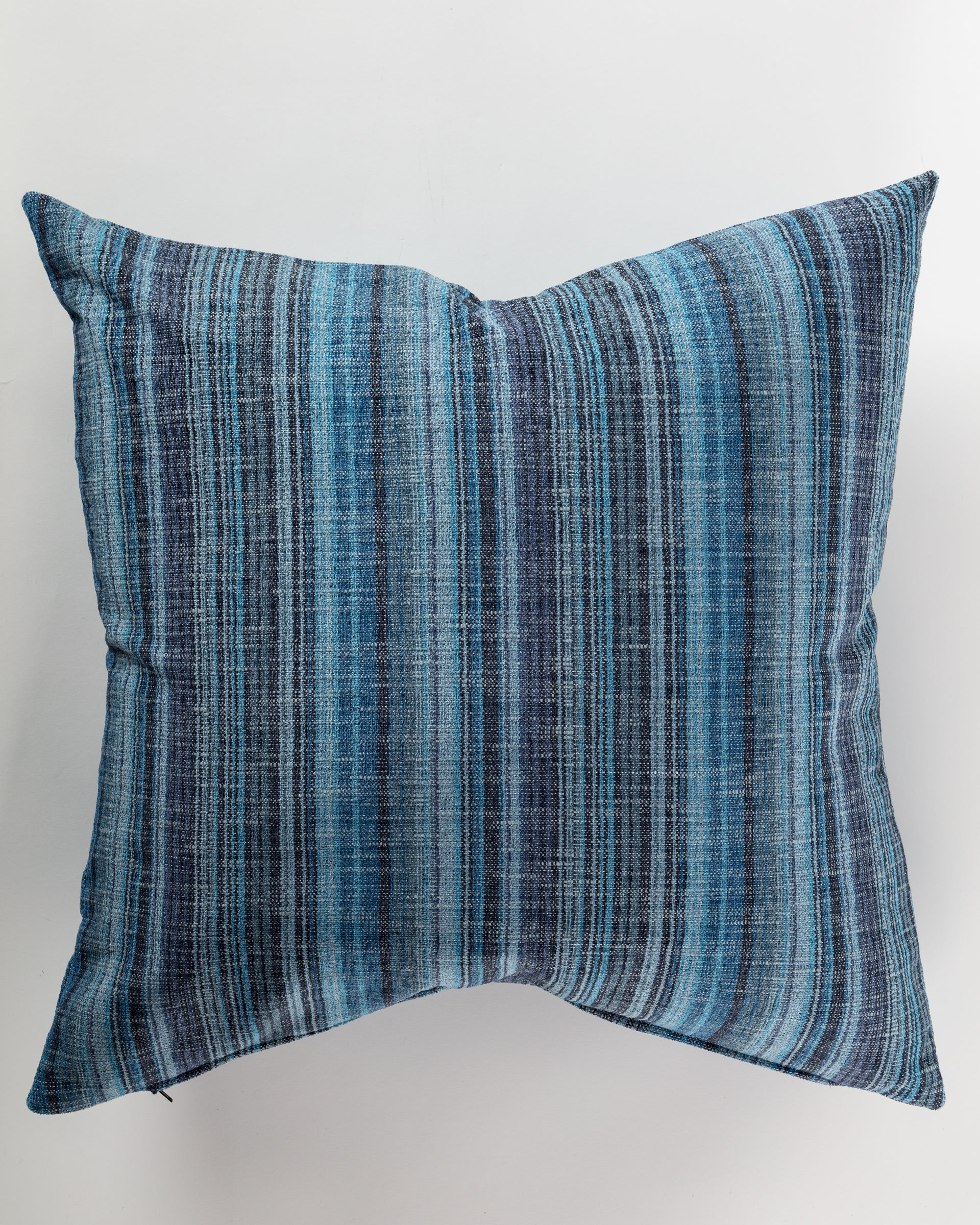 The Pindler Custom 3 Pillow 28x28 features a luxurious design with vertical blue and gray stripes set against a white background. Its textured fabric, enhanced by a subtle gradient effect, provides both comfort and stylish support for any setting.