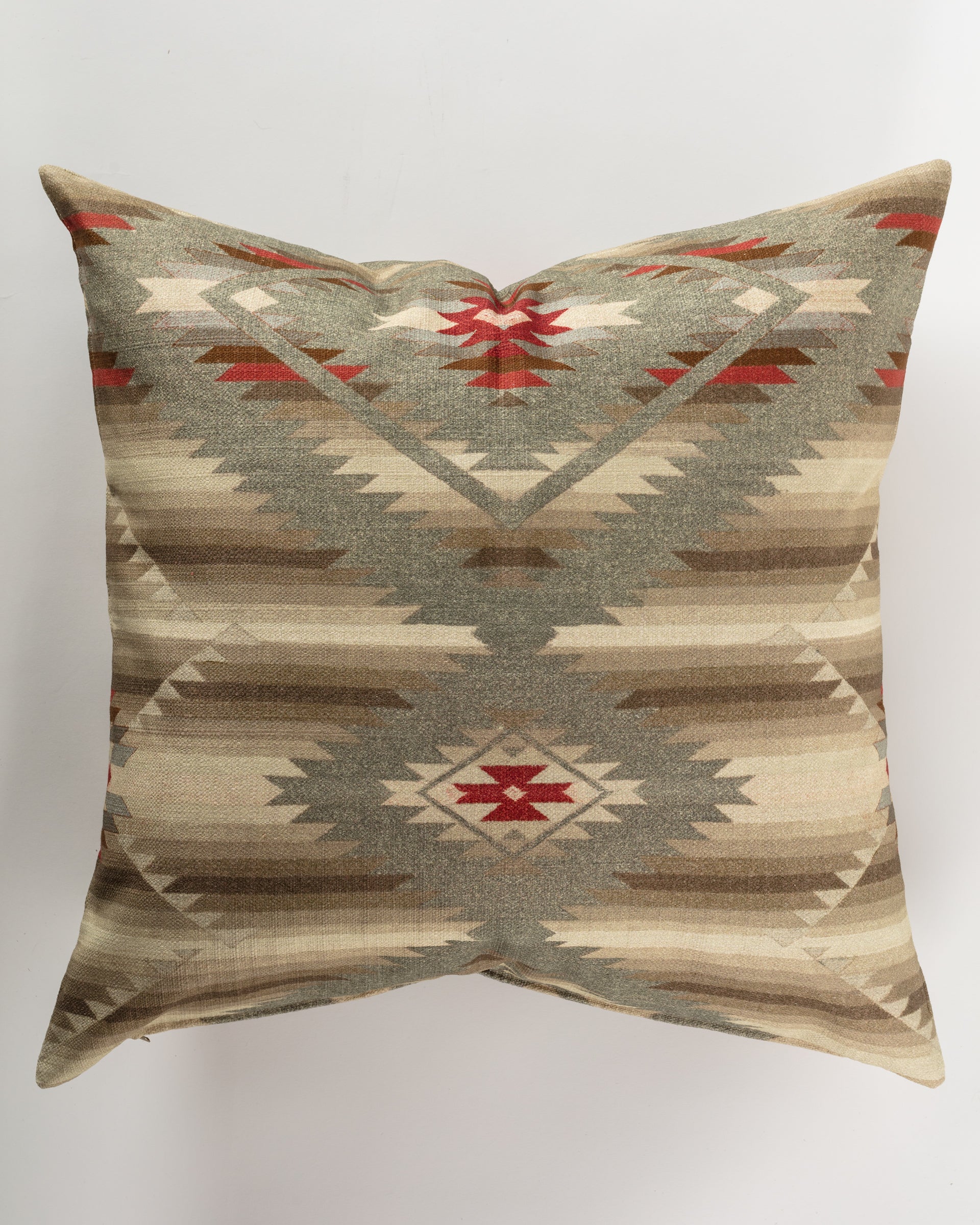 The Custom 3 Pillow 28x28 by Pindler is a square decorative piece that boasts a Southwestern-style geometric pattern in hues of beige, brown, green, and red. Featuring diamond and zigzag motifs on a neutral backdrop, it seamlessly blends comfort with the elegance of luxurious euro pillows.