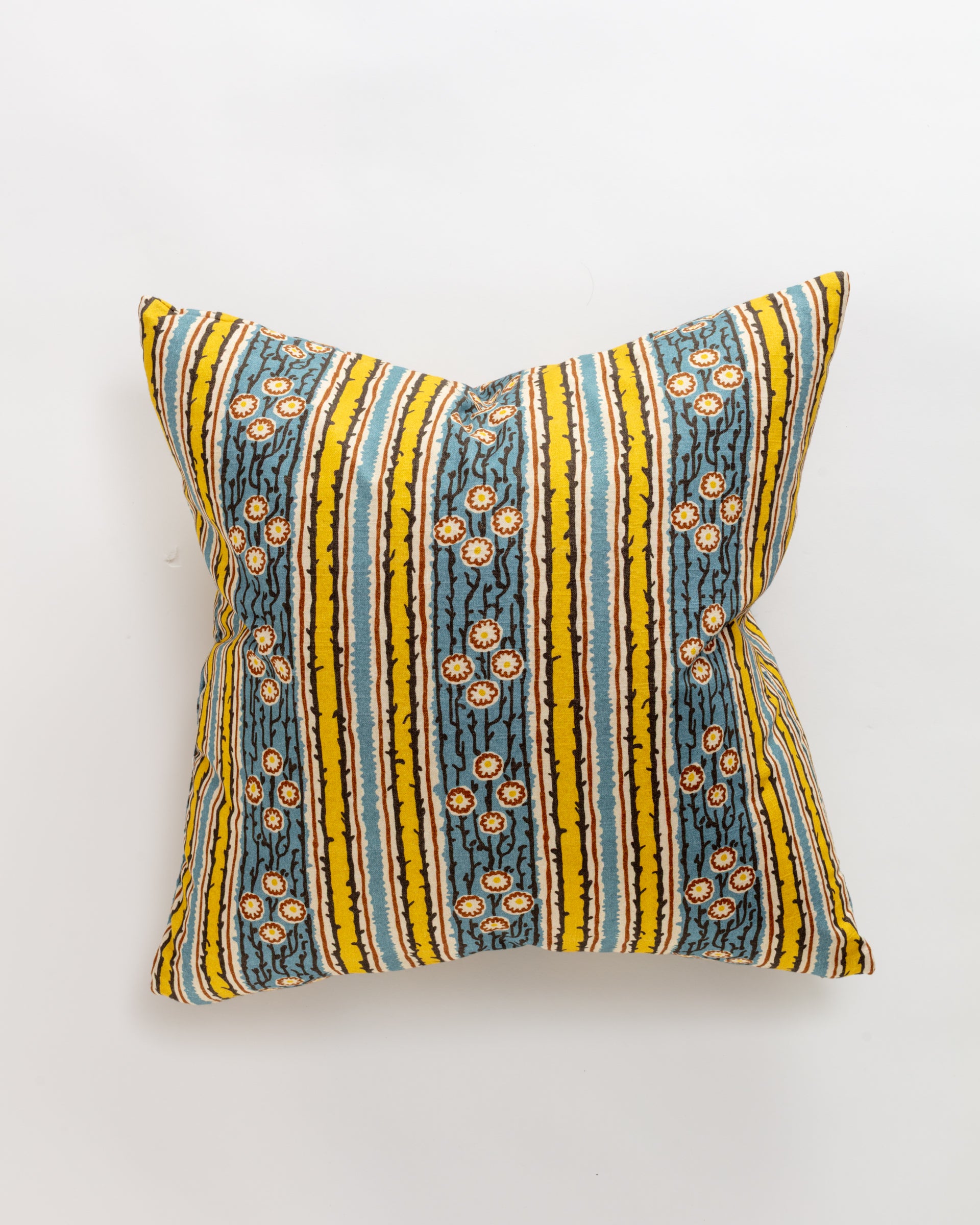 The Leo Pillow by Norwalk is an ultra-luxurious Euro pillow (26x26") featuring vertical stripes in yellow, blue, and white. Its vibrant design includes small orange and white floral patterns on a light background, ideal for support and layering.