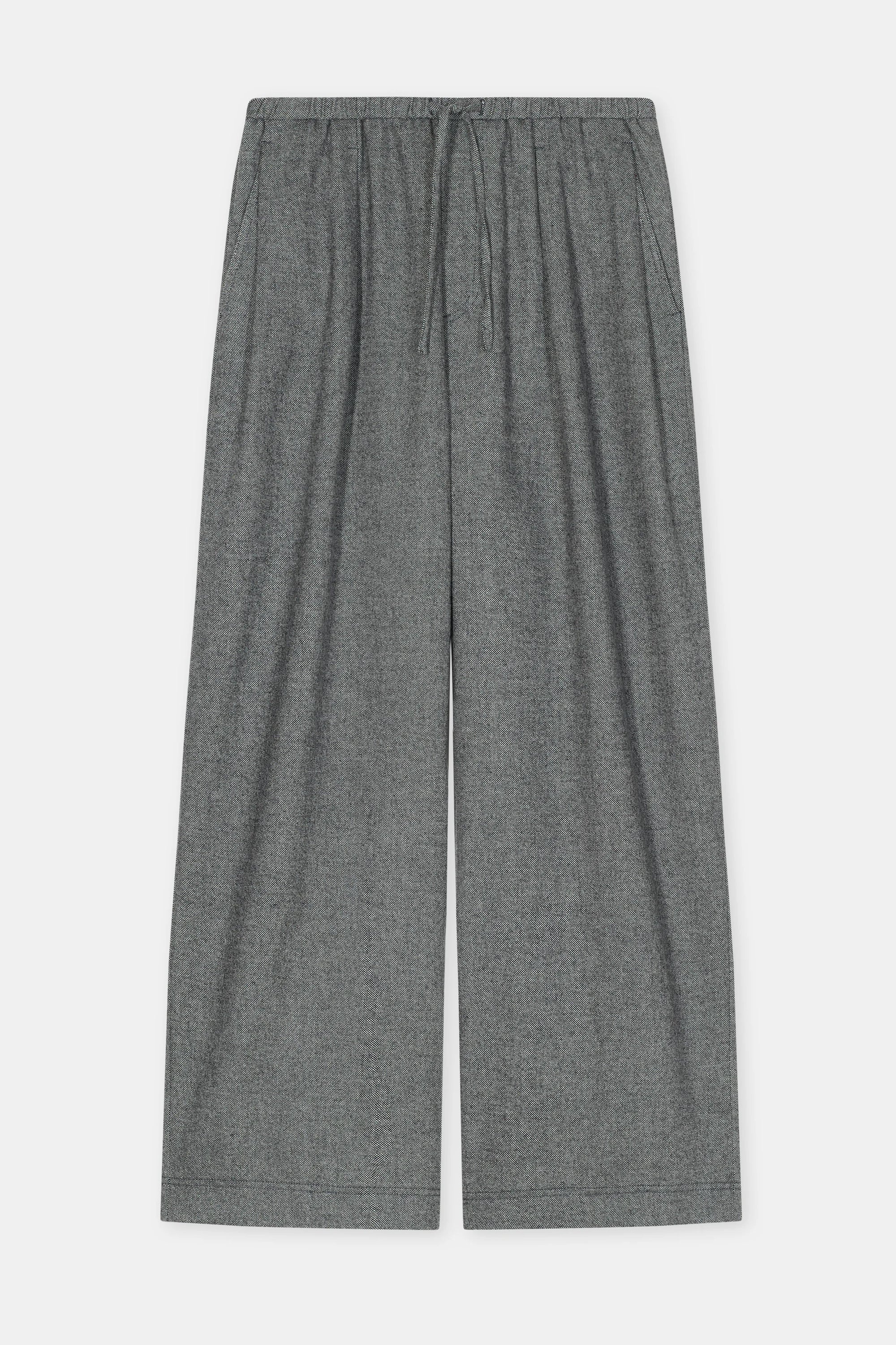 Gray relaxed fit wide leg trousers with elastic waistband and drawstring by CLOSED, displayed on white background.