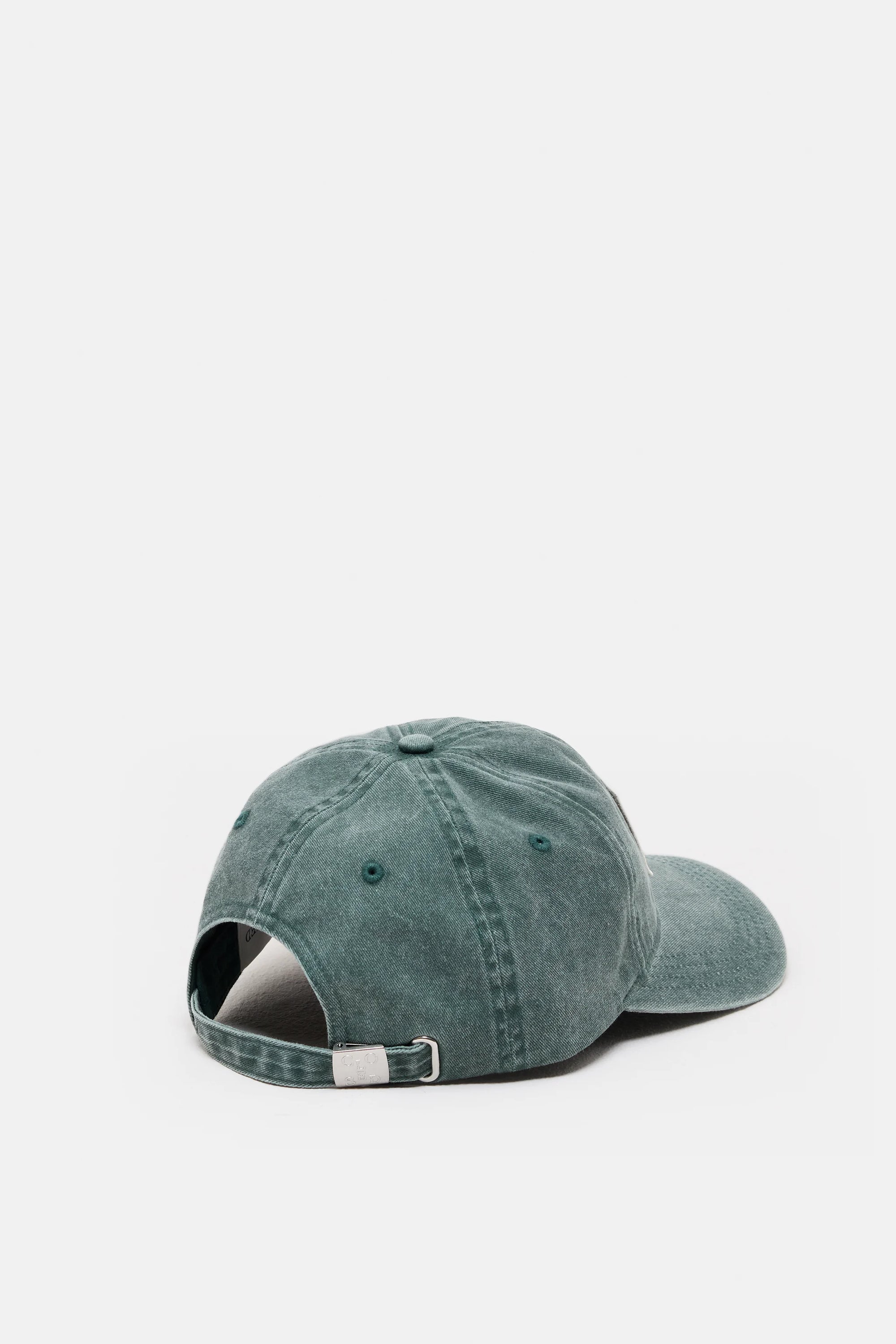 The CLOSED Cap in teal cotton is shown from the back, highlighting its adjustable strap with a metal buckle and washed finish for casual comfort against a white background.