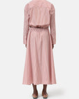 A person stands facing away, wearing CLOSED's Gathered Skirt—a long-sleeved, red-and-white vertically striped midi dress with a gathered skirt and elasticated waistband—paired with flat shoes against a plain white background.