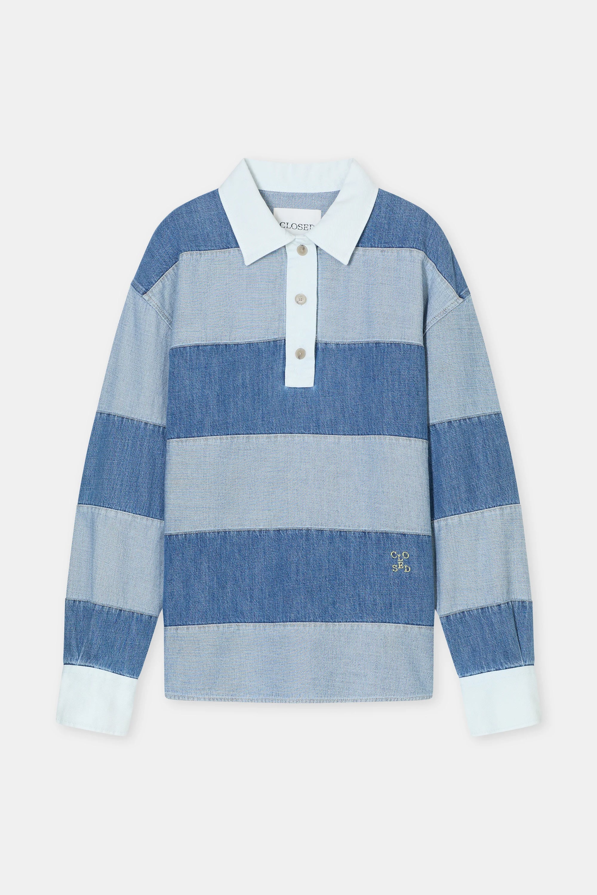 The CLOSED Rugby Shirt is made from organic cotton with wide blue and light blue stripes, white cuffs and collar, a buttoned placket, and a small gold embroidered logo near the hem.