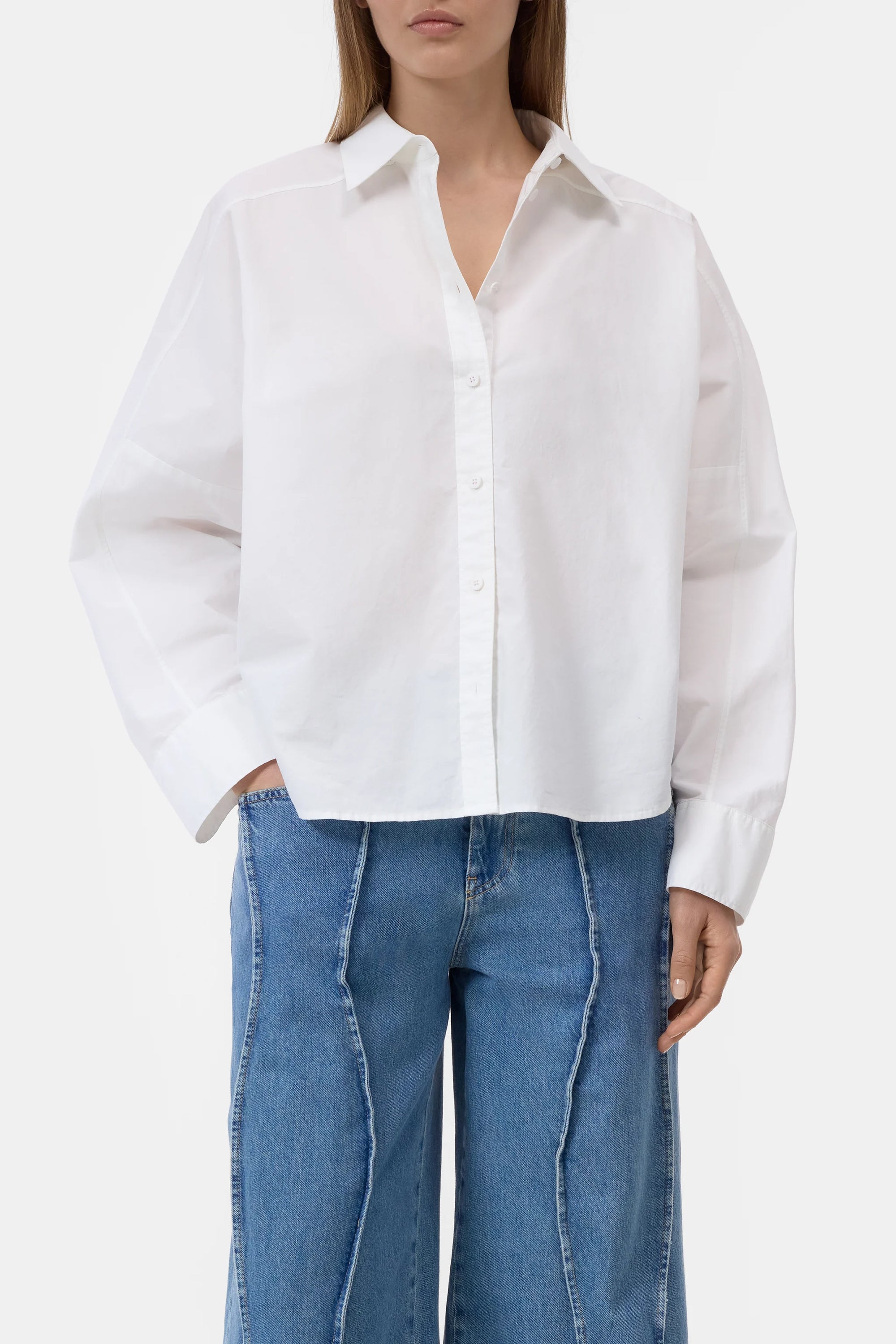 CLOSED embroidered shirt with high-waisted jeans, neutral background, modern style for Bungalow Furniture &amp; Accessories.