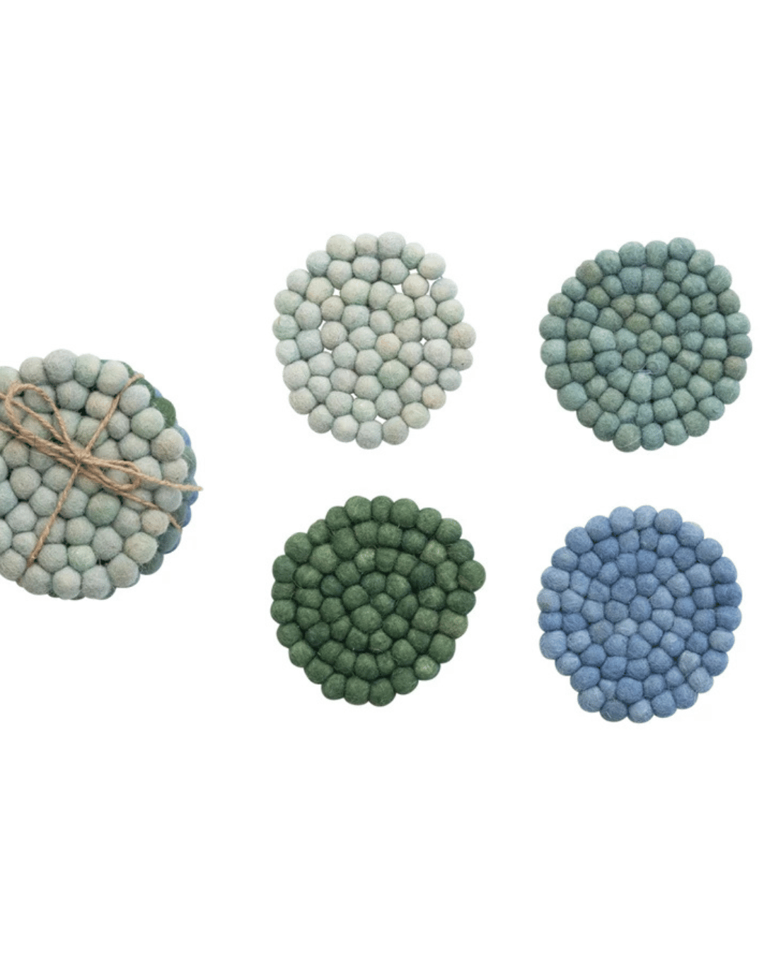 Introducing the Wool Felt Coasters Blue Tone S/4 from Creative Co-op. This set includes four exquisite handmade coasters crafted from small felted wool balls, available in beautiful shades of green, blue, and gray. Each coaster is arranged in a circular pattern to add the perfect touch to your home décor. While four are ready for individual use, one set comes elegantly tied together with twine.