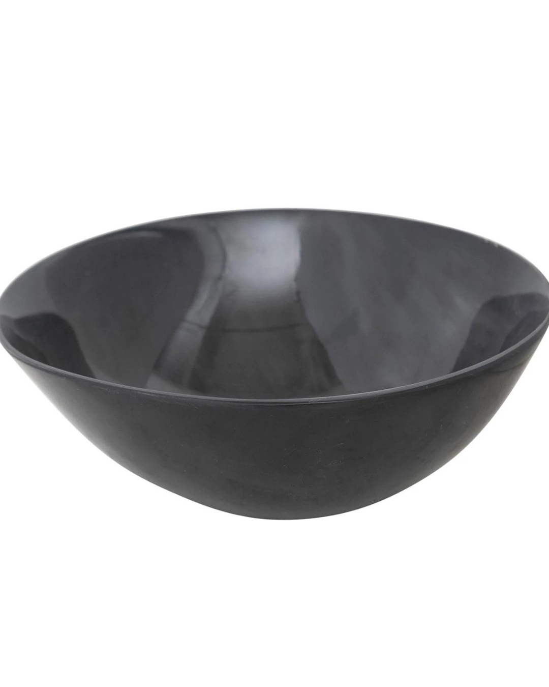 A smooth, dark gray ceramic bowl with a glossy finish and a 4-3/4" round shape, the Creative Co-op Round Horn Bowl features a sleek, reflective surface on both the interior and exterior. Its minimalist and modern design is truly unique.