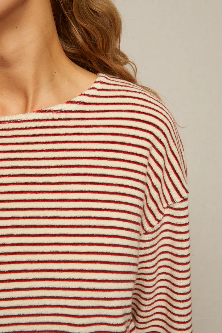Close-up of the Perfectwhitetee Cami Terry Stripe LS: a slouchy, cream long sleeve with red and black horizontal stripes. Soft plush loop terry texture is highlighted near the neck, shoulder, and hair for a cozy look.