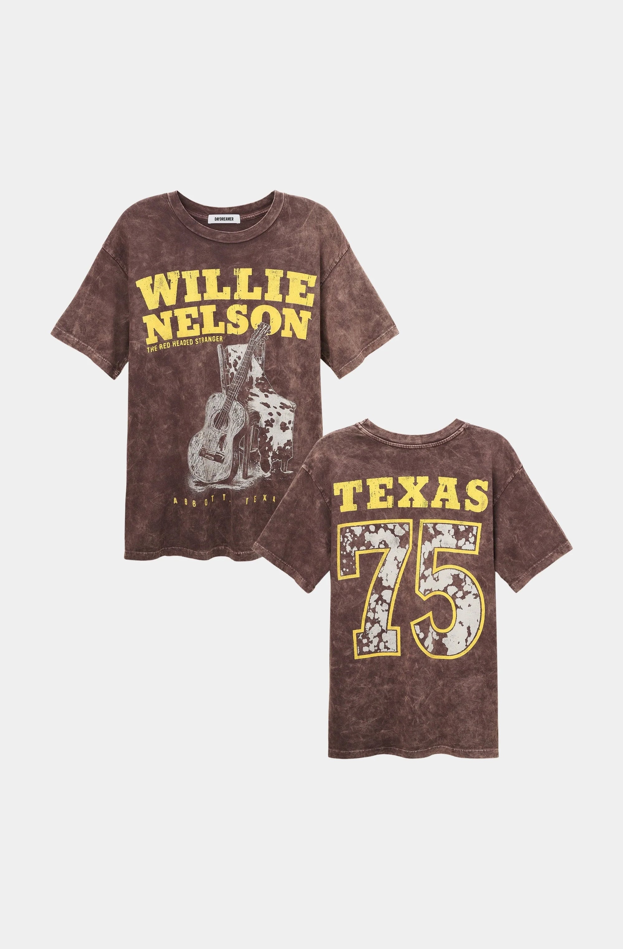 Two brown, vintage-style DayDreamer Willie Nelson Red Headed Stranger Tees. The front has yellow "Willie Nelson" text and a guitar graphic; the back reads bold "Texas 75" with a faded star—ideal for any outlaw country fan.