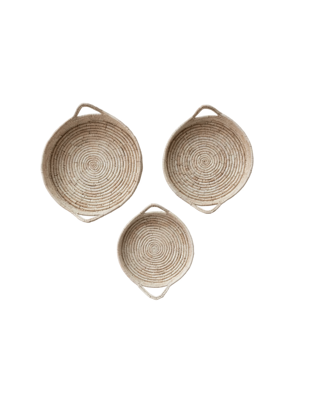 Three round, Grass &amp; Date Leaf Baskets with loop handles, arranged in a triangular formation on a white background in a Scottsdale Arizona bungalow by Creative Co-op.