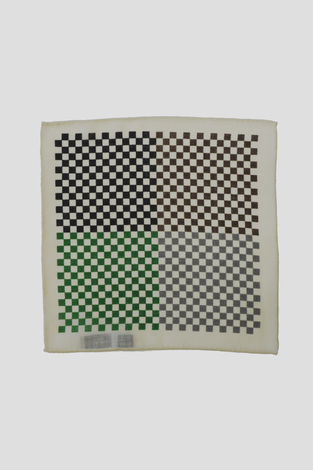 Product Description: The MENS 4 Sided Checker Pocket Square by Curated Basics is a square accessory that features a silk-screened checkerboard pattern with sections in black, green, brown, and gray. It boasts a wool background in a light neutral hue, accentuated by hand-rolled edges.