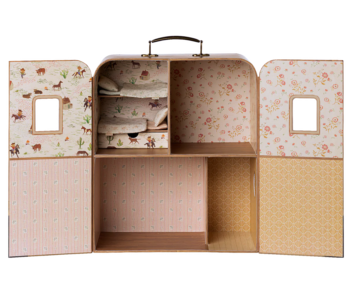 The Maileg Mouse wardrobe by Maileg features patterned interiors, shelves with folded fabric for your Maileg Mouse family, empty compartments, small windows on the doors, and a practical carry handle on top.