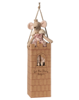 The Maileg Royal Mouse by Maileg sits atop a cardboard castle tower with a window and "Let the story begin" text. Hanging by a rope, this charming piece is ideal for collectors of royal mice and enchanting mouse figurines.