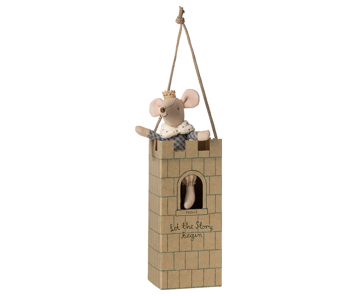 The Maileg Royal Mouse by Maileg wears a crown and cape, sitting on a cardboard castle tower with a window, rope for hanging, and "let the story begin" written on it.