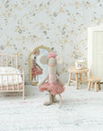 A Maileg toy mouse in a pink tutu stands before the Maileg Mirror in a miniature bedroom with a bed, wardrobe, stool, table, and floral wallpaper.