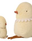 The Maileg Chicken Plush, Small is an adorable yellow plush bird with a brown yarn bow and orange beak. With a soft feel, it sits alongside a larger matching bird on a white background.