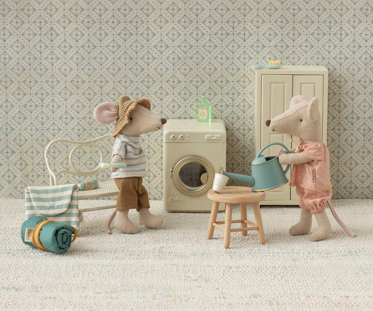 Maileg Hiker Mouse waters a plant while another mouse lounges, styled in a cozy, playful camping scene.