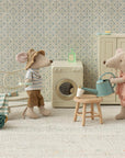 Maileg Hiker Mouse waters a plant while another mouse lounges, styled in a cozy, playful camping scene.