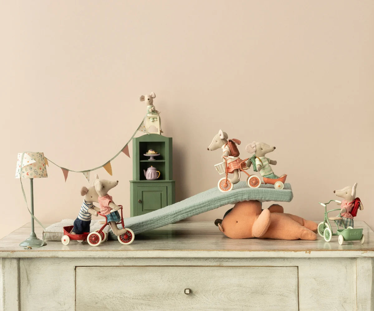 Maileg toy mice on teddy bear with Corner Cabinet, styled in pastel Mouse Hole Farmhouse by Bungalow Furniture &amp; Accessories.