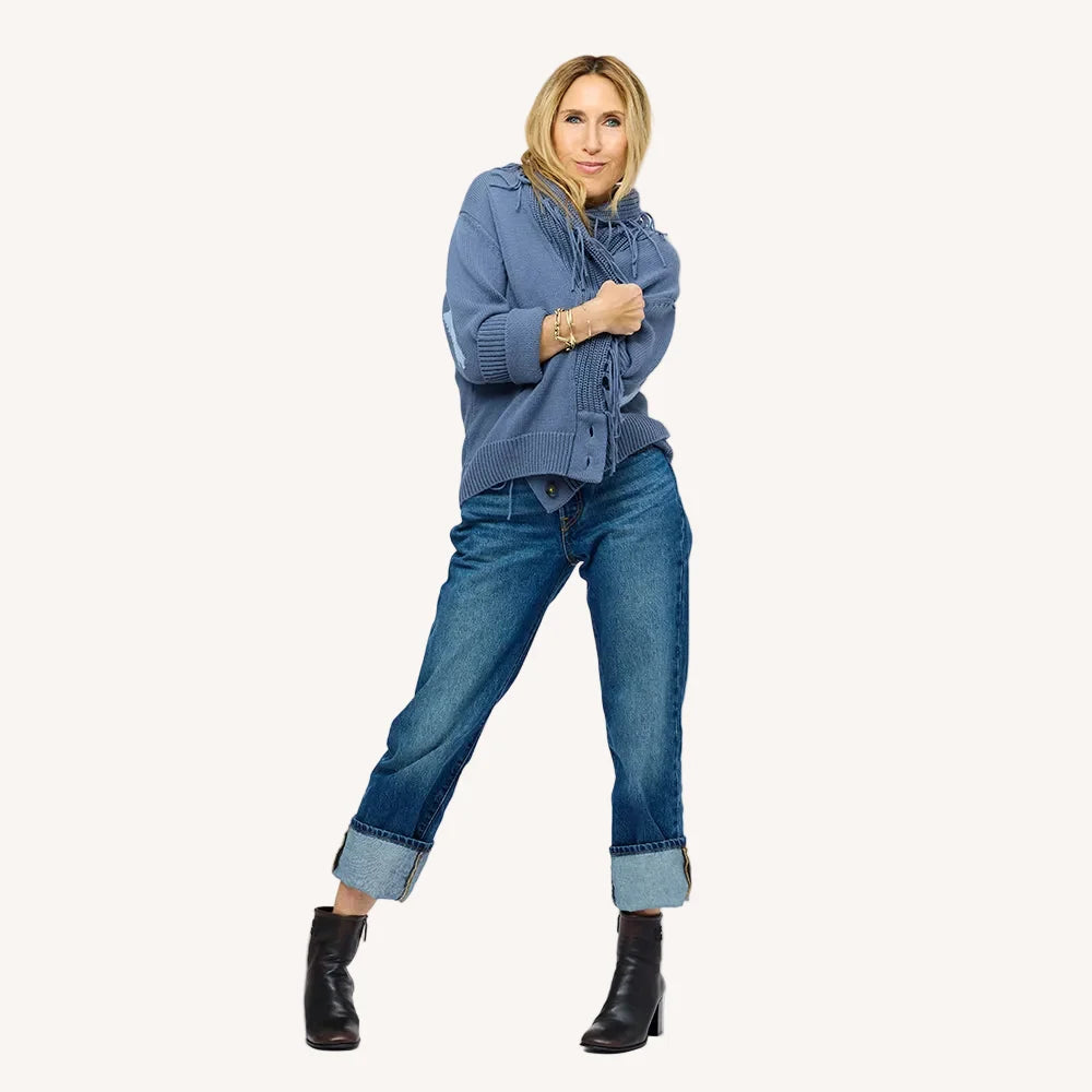 Kerri Rosenthal Fringe Shawl Collar Love Cardigan styled with cuffed jeans and black ankle boots, arms crossed.