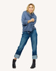 Kerri Rosenthal Fringe Shawl Collar Love Cardigan styled with cuffed jeans and black ankle boots, arms crossed.