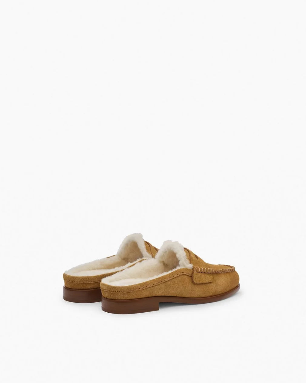 The Rag &amp; Bone Carter Mule is a tan Italian-milled suede slip-on moccasin slipper with white fur lining and brown soles, shown on a plain white background.