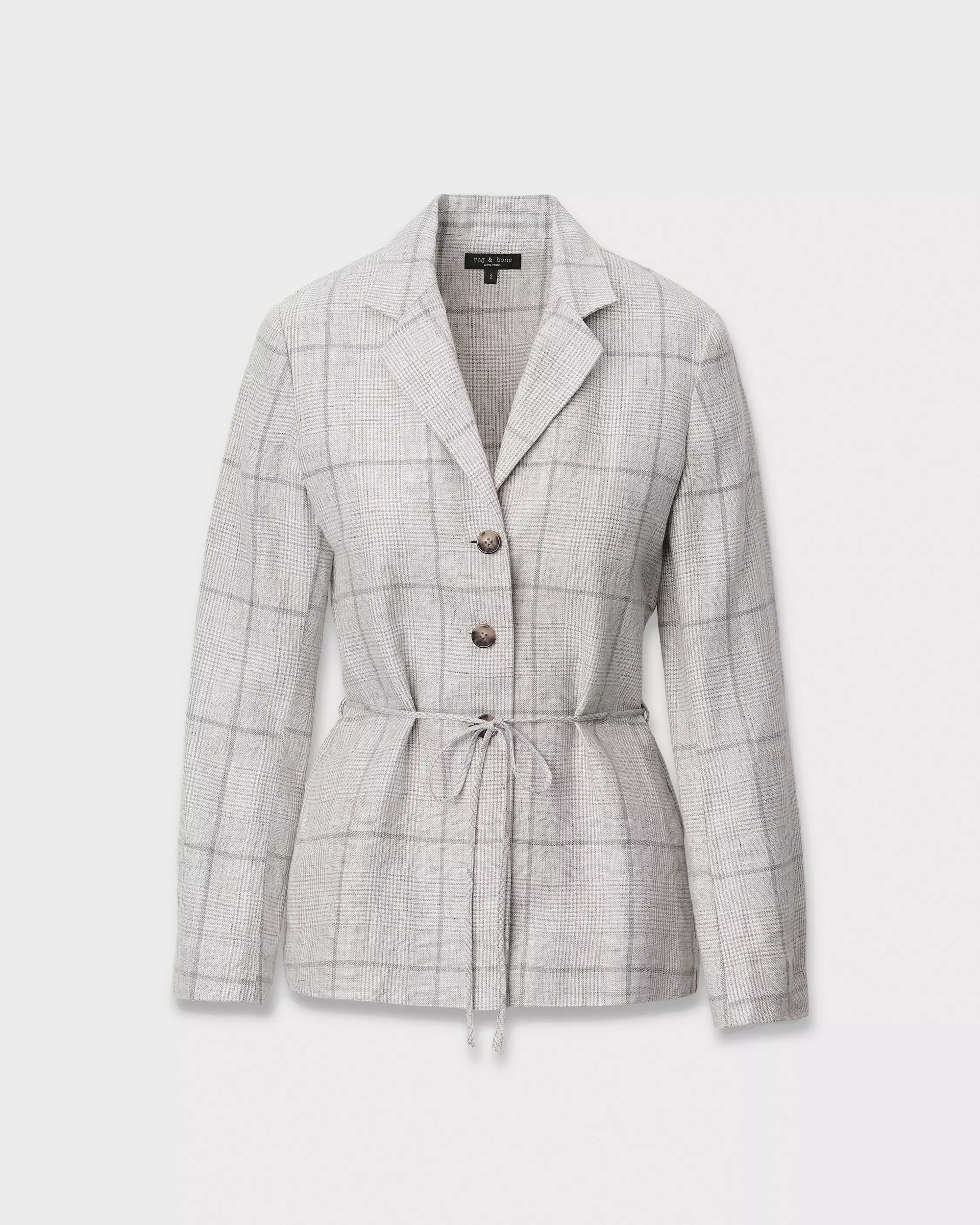 The chappell plaid blazer by Rag & Bone features a light gray linen plaid, notched collar, two brown buttons, long sleeves, and a fitted drawstring waist, shown against a plain white background.